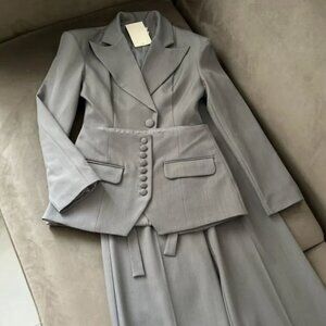 Wonderful three-piece suit light gray with a peplum. NWOT, size S